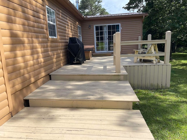 wooden deck with a yard