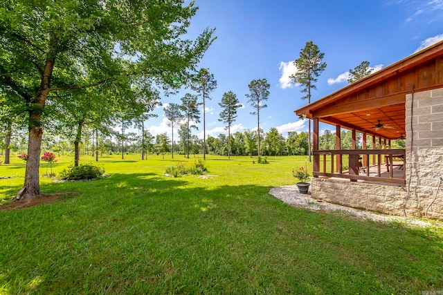 view of yard featuring ceiling fan