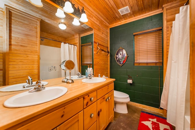 bathroom with wooden ceiling, toilet, wooden walls, vanity, and tile walls