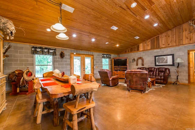 dining area with french doors, lofted ceiling, and wood ceiling