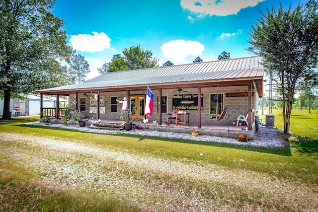 back of house featuring french doors, a yard, ceiling fan, and central air condition unit