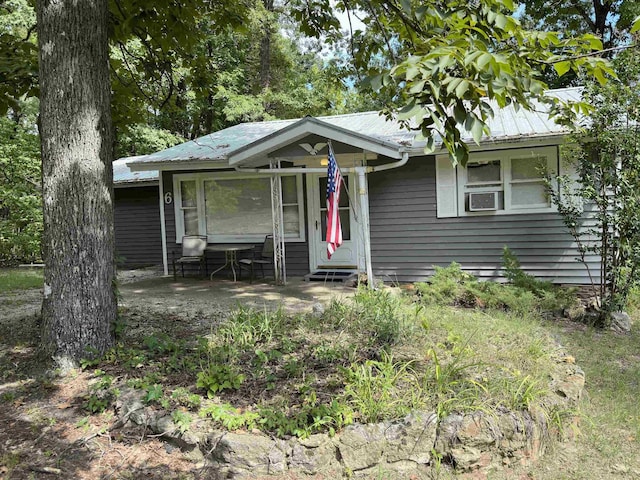 view of front of house featuring cooling unit