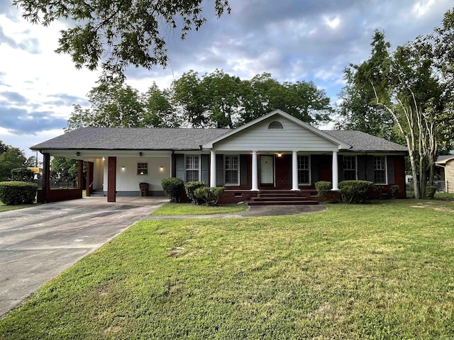 view of front of property with a front yard, a porch, and a carport