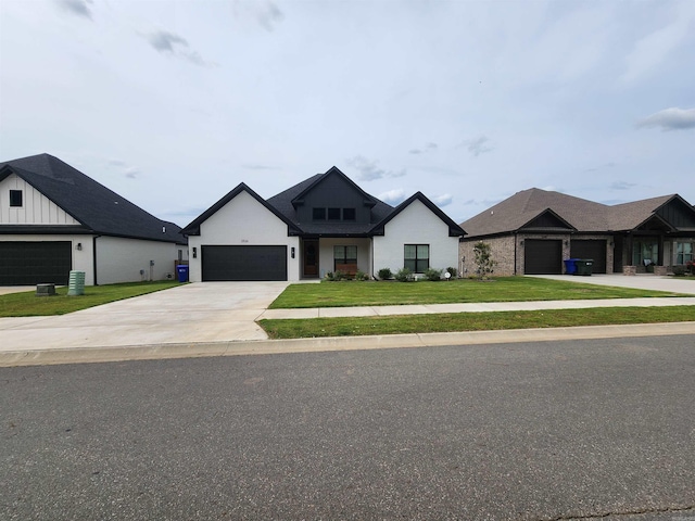 view of front facade featuring a front yard and a garage