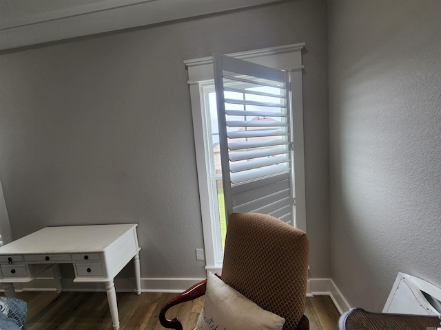 living area with hardwood / wood-style floors