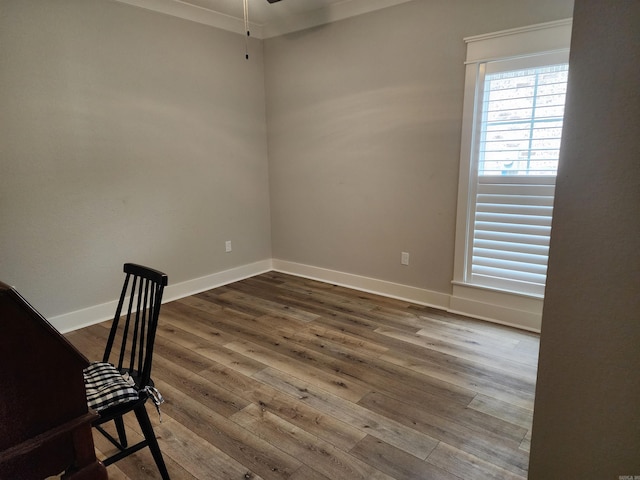 interior space featuring hardwood / wood-style flooring and ornamental molding