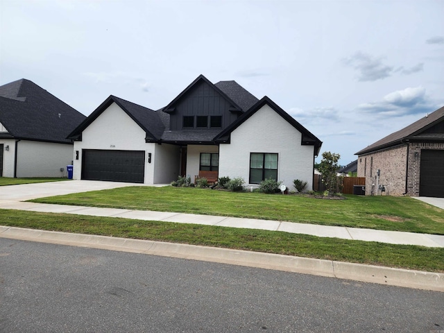 view of front of house with a garage, central air condition unit, and a front lawn