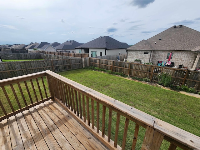 wooden deck with a yard