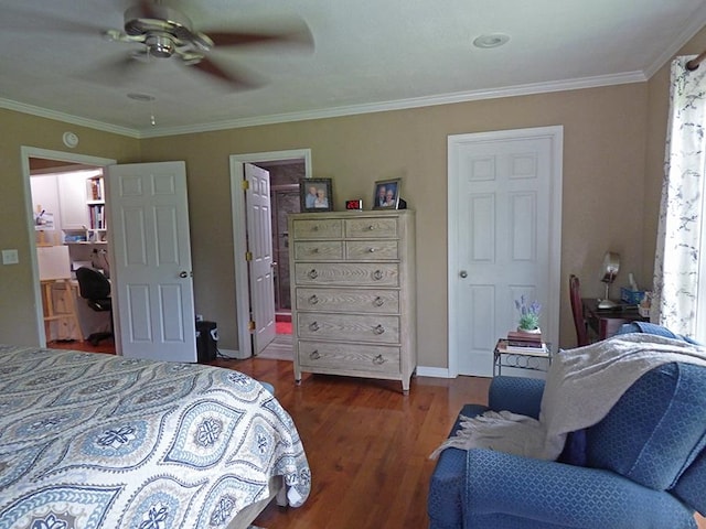 bedroom featuring crown molding, ensuite bathroom, ceiling fan, and dark hardwood / wood-style flooring