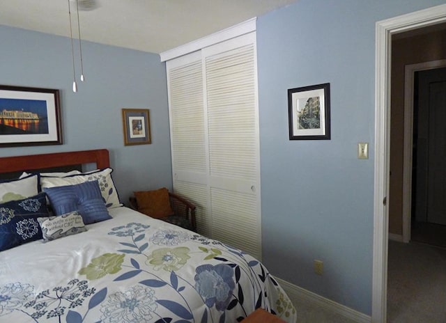 bedroom with a closet and carpet floors