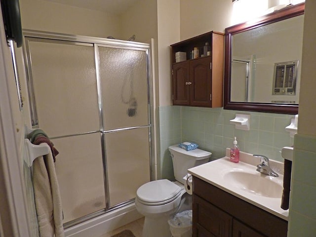 bathroom with a shower with shower door, toilet, tile walls, backsplash, and oversized vanity