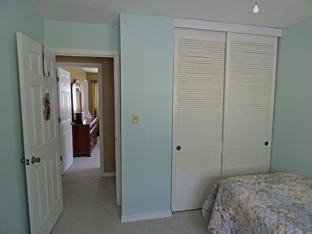 carpeted bedroom featuring a closet