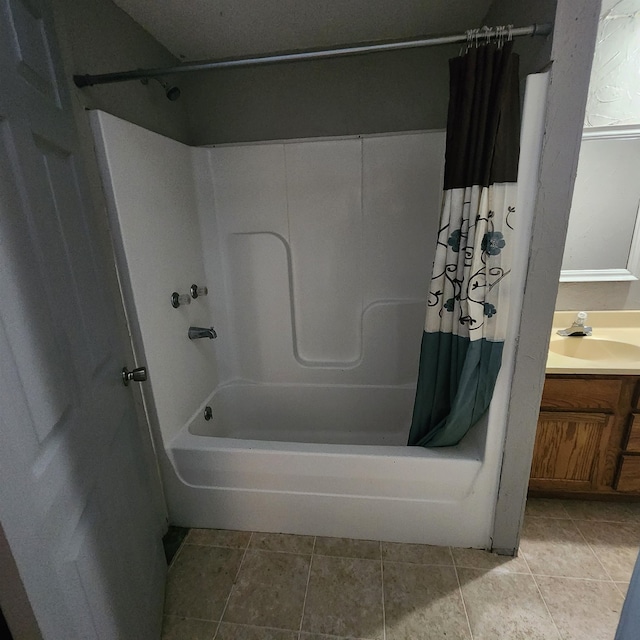 bathroom with tile flooring, shower / bath combination with curtain, and vanity