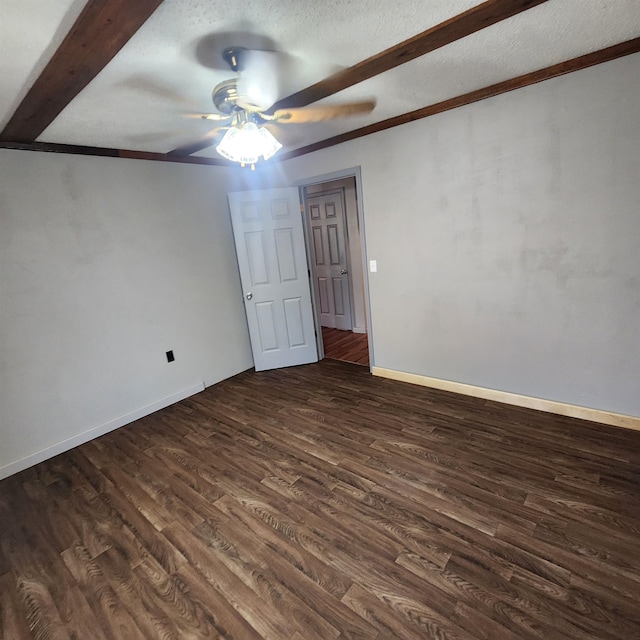 unfurnished room with dark wood-type flooring, ceiling fan, and a textured ceiling