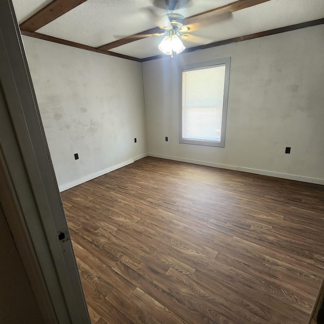 spare room featuring a textured ceiling, ceiling fan, and dark hardwood / wood-style flooring