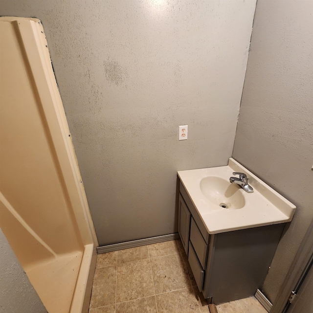 bathroom featuring vanity and tile floors