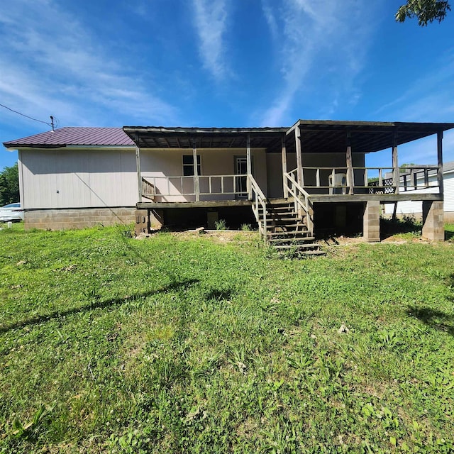 1947 63rd Hwy, Hardy, AR 72542 - back of property featuring metal roof, stairway, a yard, and a wooden deck