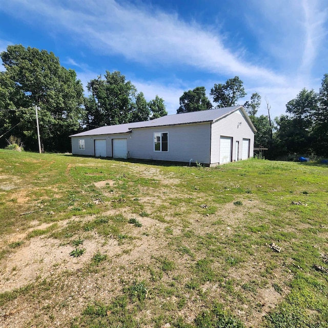 view of yard with a garage