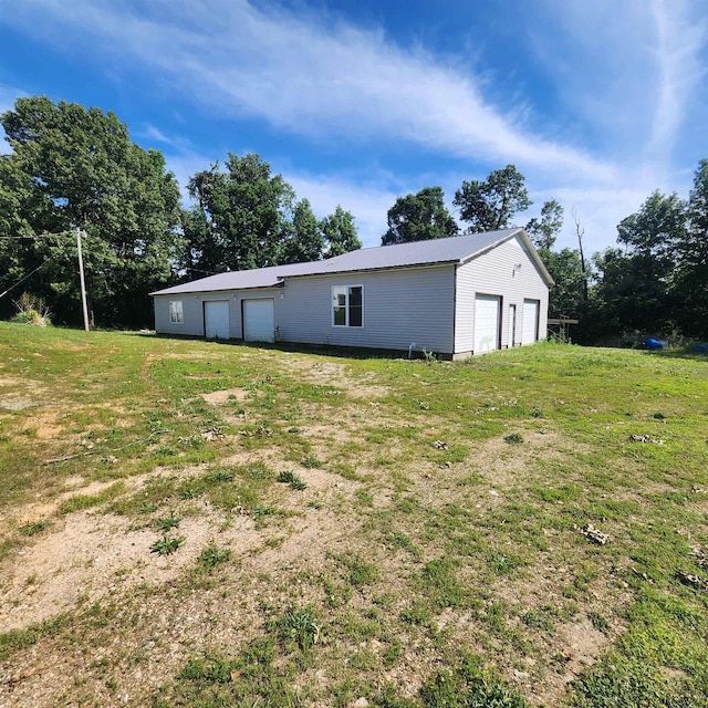 1947 63rd Hwy, Hardy, AR 72542 - back of house with an outbuilding and a garage