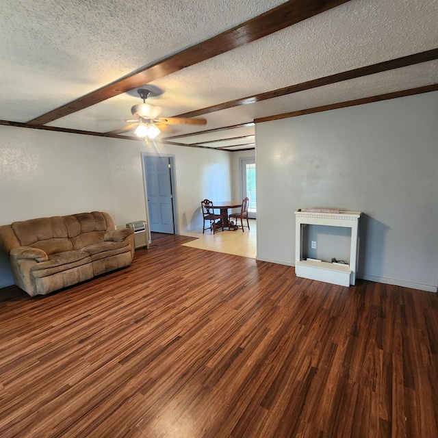 1947 63rd Hwy, Hardy, AR 72542 - unfurnished living room with wood finished floors, ceiling fan, and a textured ceiling
