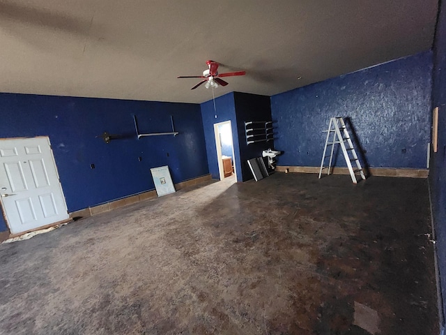 interior space featuring concrete floors, a textured ceiling, and ceiling fan