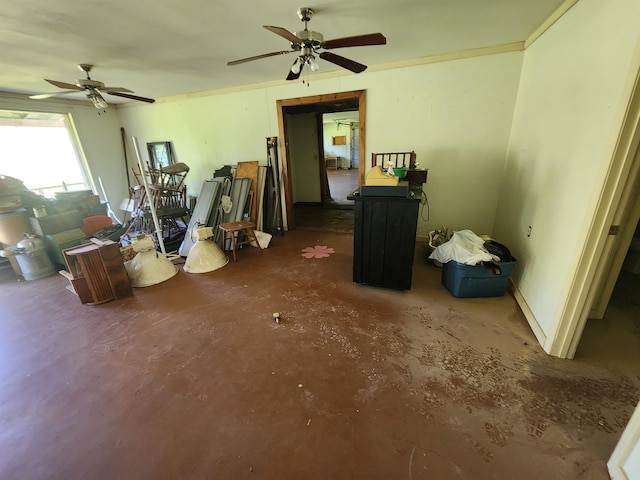 miscellaneous room featuring ceiling fan and concrete flooring