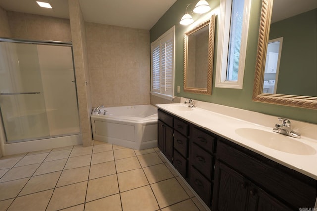 bathroom with tile patterned floors, vanity, and plus walk in shower