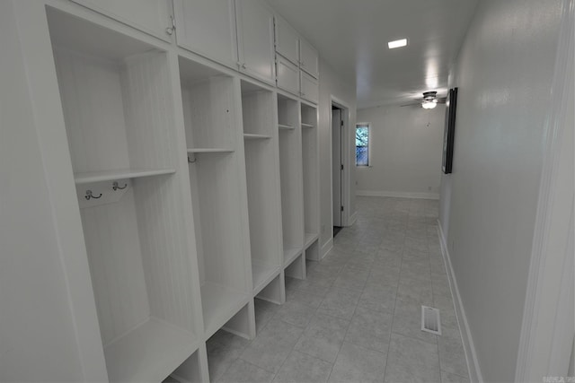 mudroom featuring light tile patterned floors and ceiling fan