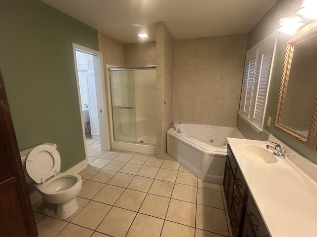 bathroom with a shower stall, toilet, tile patterned floors, a tub with jets, and vanity