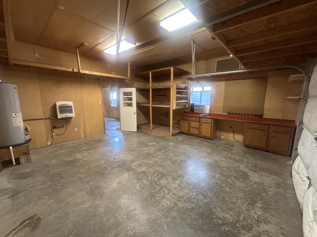 basement with heating unit and water heater