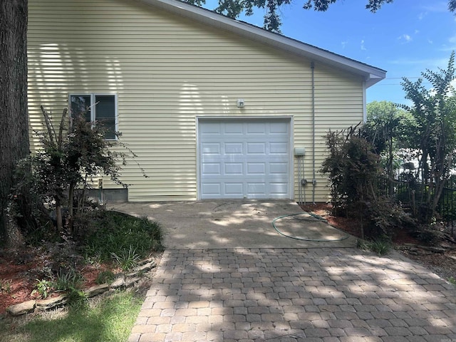 view of property exterior with a garage