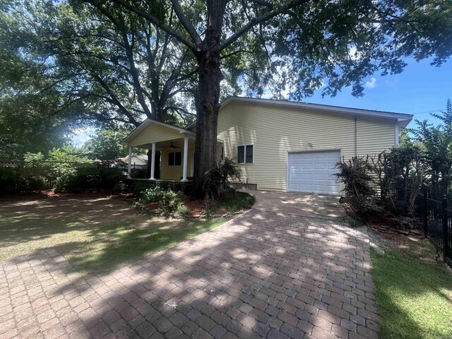 view of front of house featuring covered porch and a garage