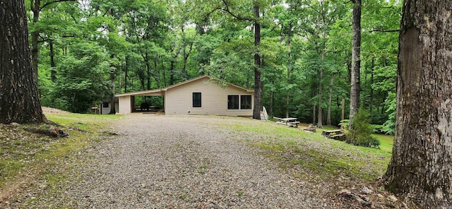 view of side of home featuring a carport