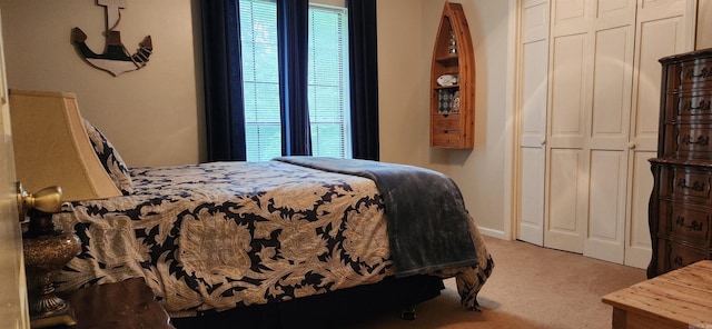 carpeted bedroom with a closet