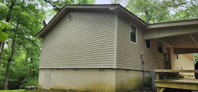 view of side of property with a deck