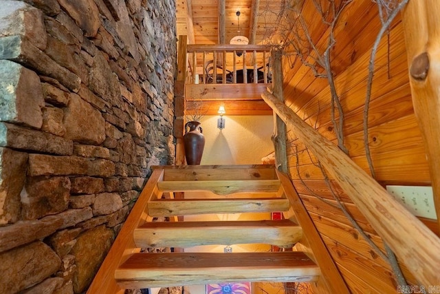 stairway featuring wooden ceiling