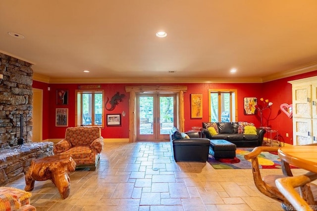 living room featuring french doors and crown molding