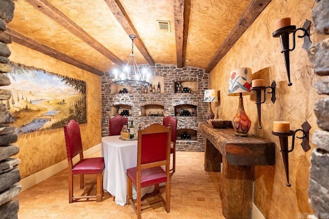 wine cellar featuring beam ceiling, light hardwood / wood-style flooring, and a notable chandelier