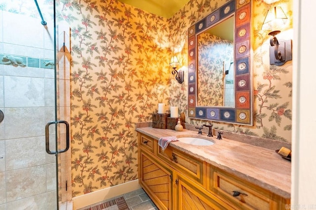 bathroom featuring tile patterned flooring, vanity, and a shower with shower door