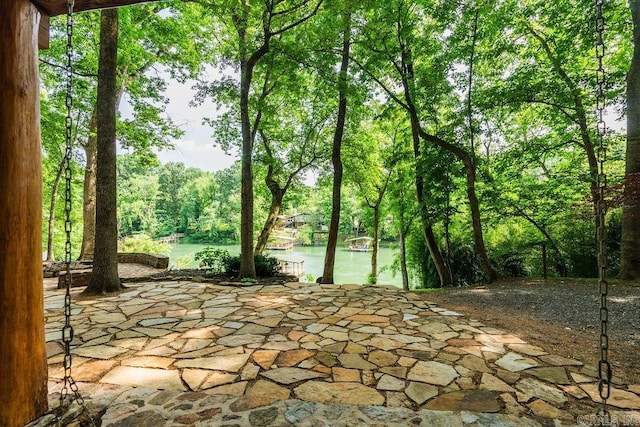 view of patio with a water view