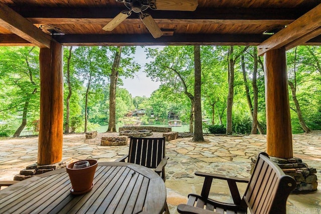 view of patio / terrace featuring ceiling fan and a fire pit