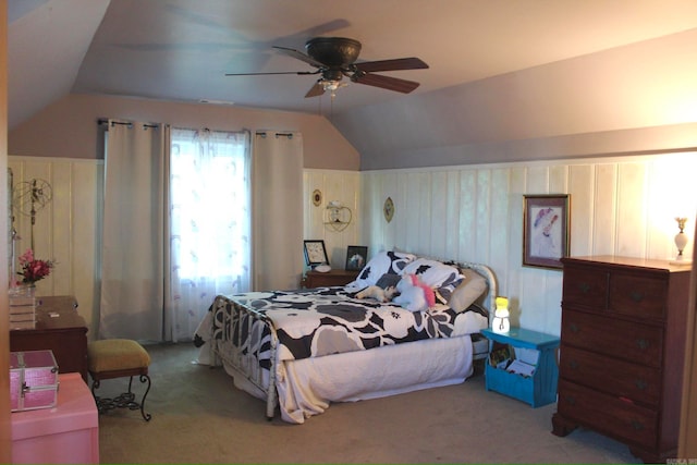 carpeted bedroom featuring ceiling fan and vaulted ceiling