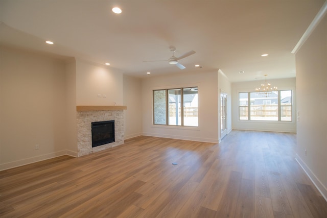 unfurnished living room featuring wood-type flooring and a wealth of natural light