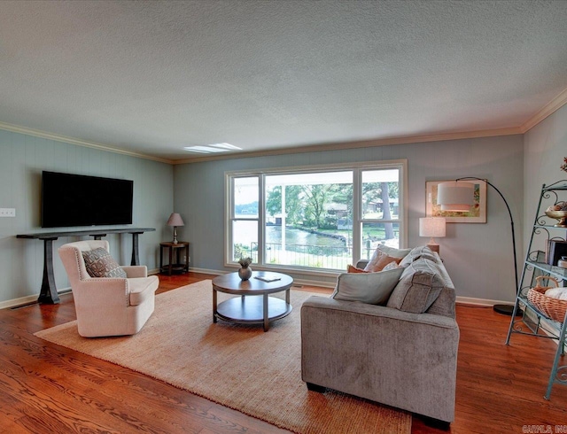 living room featuring ornamental molding, a textured ceiling, and hardwood / wood-style flooring