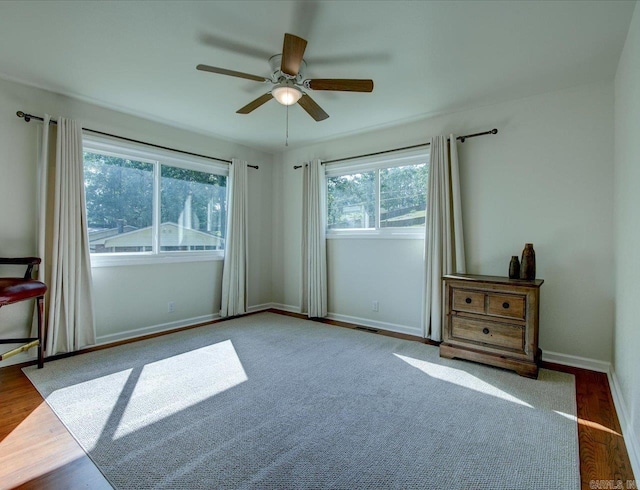 spare room featuring hardwood / wood-style floors and ceiling fan