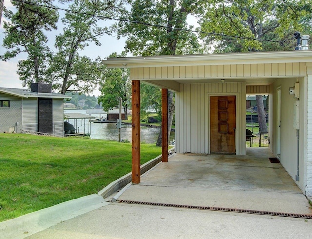 exterior space featuring a water view and a yard