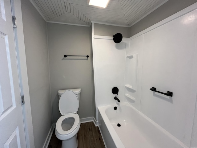 bathroom featuring shower / tub combination, wood-type flooring, and toilet