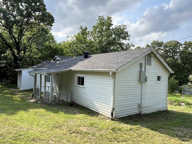 back of house with a yard