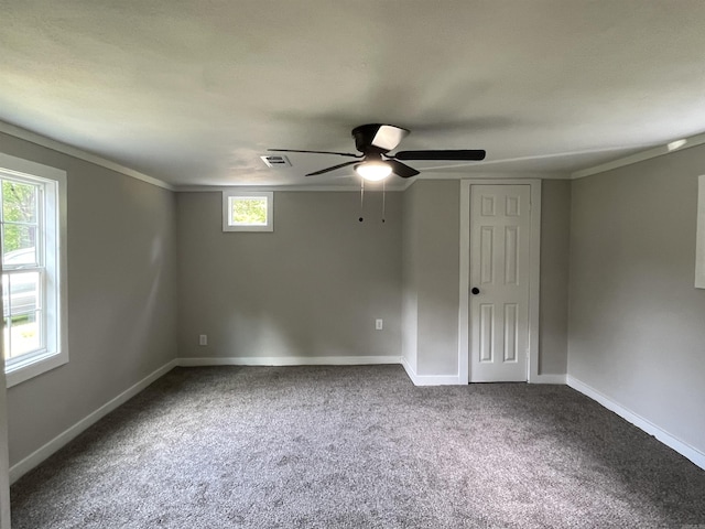 unfurnished room featuring crown molding, carpet floors, and ceiling fan