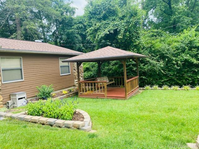 view of yard with a gazebo and a deck